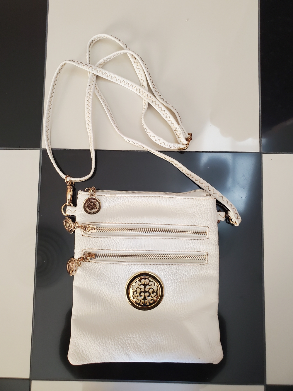 White Crossbody Bag with Gold Medallion Accent